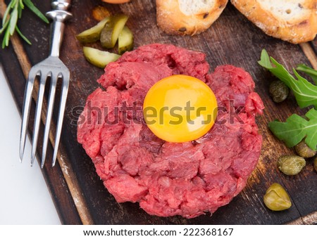 fresh beef tartar with egg, close-up.