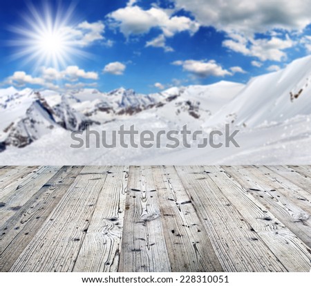Winter background with wooden table. Ideal for your product placement.