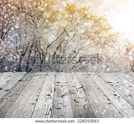 Winter background with wooden table. Ideal for your product placement.