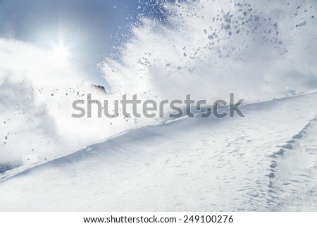 Snow explosion on mountains, freeze motion.