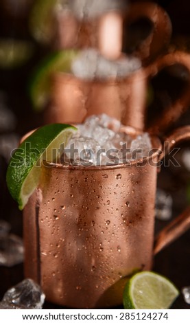 Cold Moscow Mules - Ginger Beer, lime and Vodka on bar