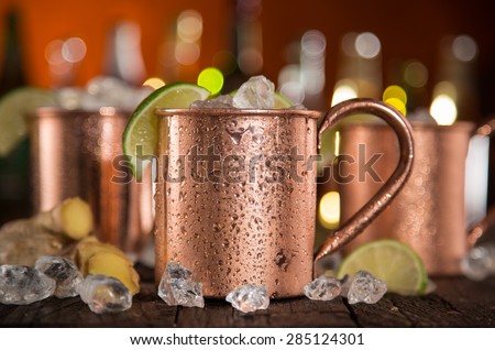 Cold Moscow Mules - Ginger Beer, lime and Vodka on bar