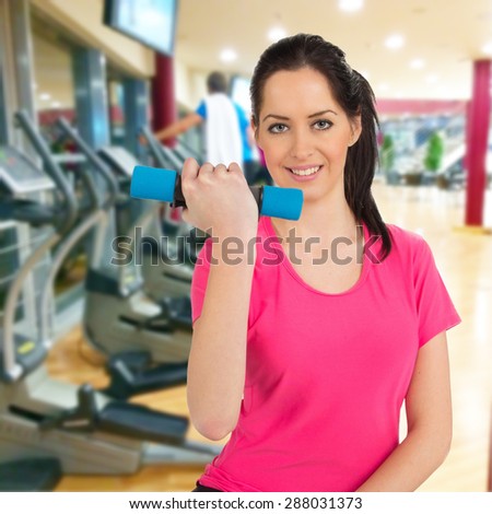 Woman training in a fitness club, close-up.