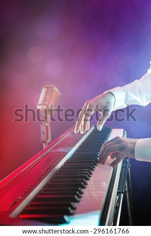 Close-up of pianist playing the piano.