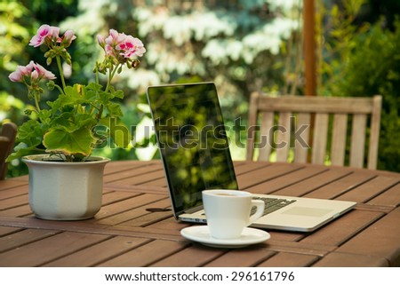 Notebook computer on garden table