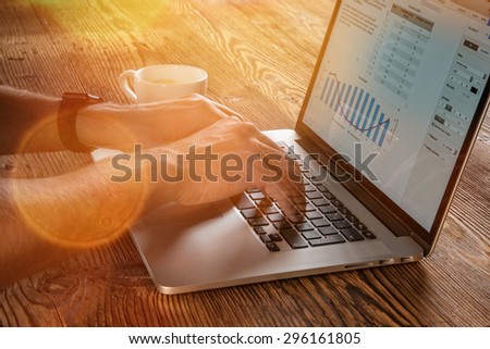 young man working from home using notebook computer