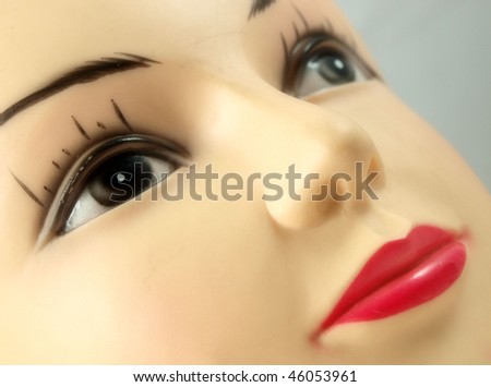 face of mannequin with red lips isolated on white background