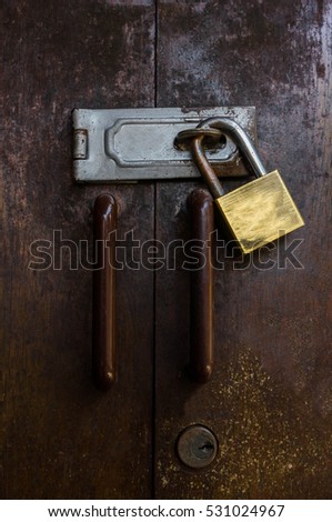 Old padlock on a wooden door,Wooden Gate Lock.