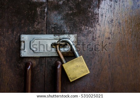 Old padlock on a wooden door,Wooden Gate Lock.