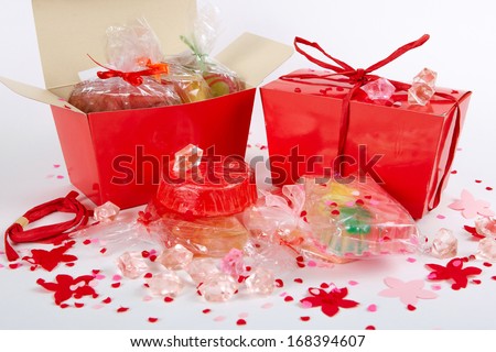 Many   handmade  soap in a red gift box on a white background