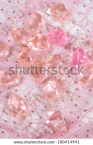 Beautiful pink colorful stones on a fabric gentle background