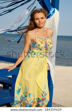 girl with Long Hair  on a background of sea and blue ribbons