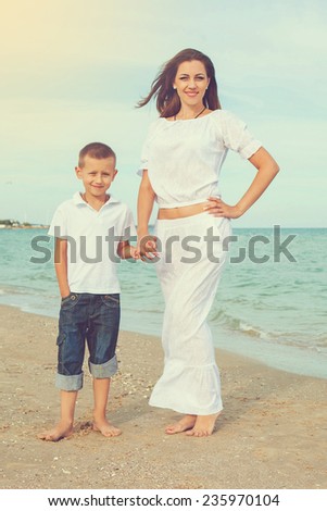 Happy family. Young happy beautiful  mother and her son having fun on the beach. Positive human emotions, feelings, emotions.