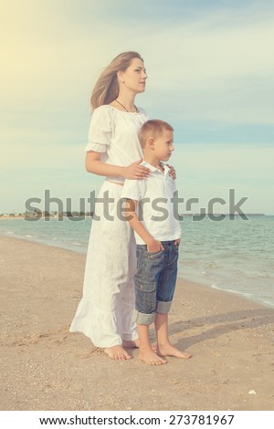 Happy family. Young happy beautiful  mother and her son on the beach. Positive human emotions, feelings, emotions.