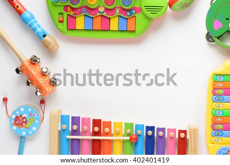 frame made of music accessories for children on white background. top view