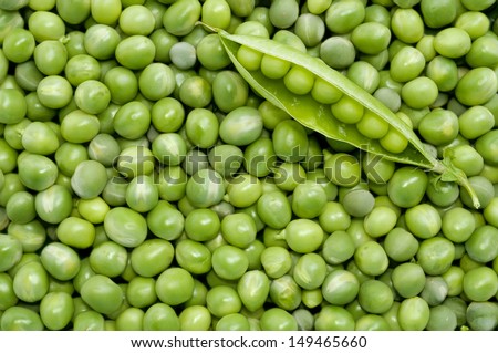 Fresh green peas background with green pea pod