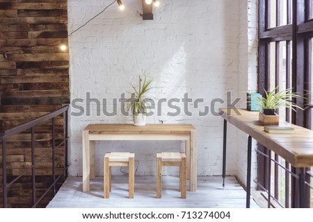 Loft furniture. Home interior. Handmade furniture. Apartment decoration. Brick wall. Loft decor. Loft Interior. Kitchen, kitchen table and chair.Divvying furniture. wood