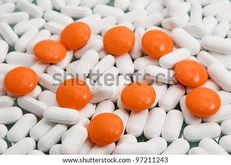 orange pills close-up on medicines