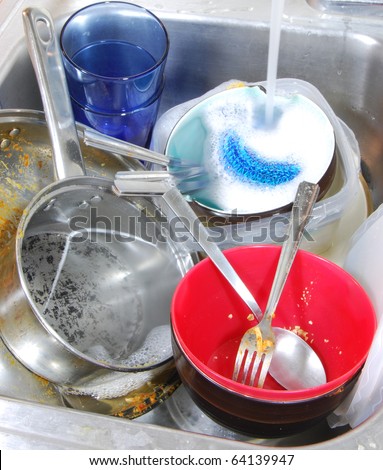 Doing house chores. Huge pile of dirty dishes to wash.