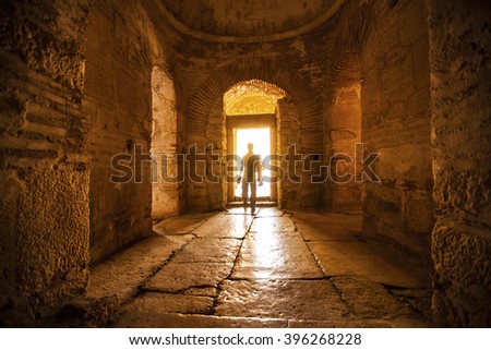 Man\'s back in an ancient stone temple in Turkey