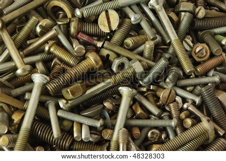 Old bolts,screws,nuts and pucks as background