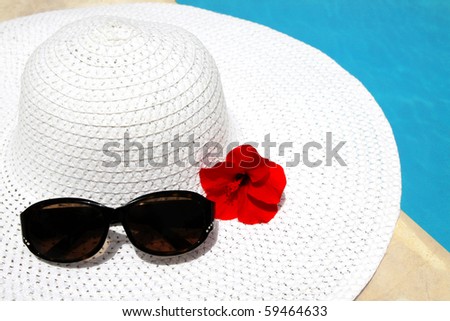 Beach accessories laying by the swimming pool