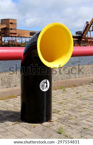 Black and yellow empty recycling bin