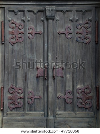Closed shut wood doors with metal binding