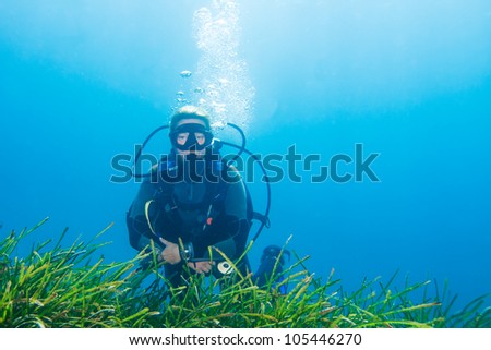 Female Scuba Diver relaxing on a dive
