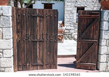 Part open gates leading to a courtyard