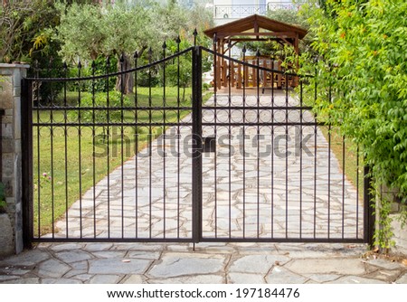 Steel security gates protecting house