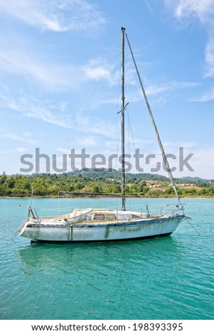 Dirty looking sailing boat in need of cleaning and repair