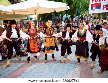PEFKOHORI , GREECE - SEPTEMBER 19 2014 : Folk Dancers from Serbia taking part in the Annual Folk Dance festival in the village square of Pefkohori ,Greece