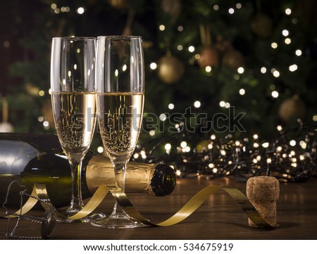 New Year Toast champagne , Christmas tree background