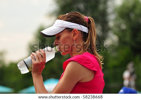 http://image.shutterstock.com/display_pic_with_logo/378145/378145,1280690473,22/stock-photo-bucharest-august-zuzana-ondraskova-hydrates-during-the-finals-of-the-itf-wta-58238668.jpg