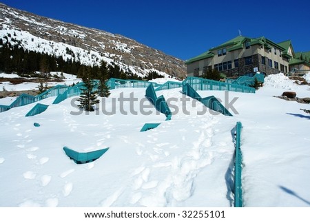 Stairs to the information center in Columbia icefield in April, covered by snow over one meter, jasper national park, Alberta, Canada