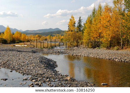 Autumn view of mountain creek bed and valley in kananaskis country, alberta, canada