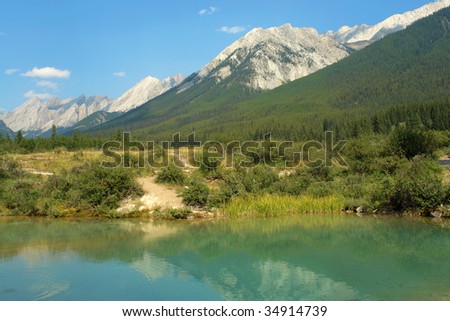 Summer view of the ink pond and surrounding rocky mountains at banff national park, alberta, canada