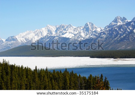 Winter view of canadian rockies and lake in kananaskis country alberta