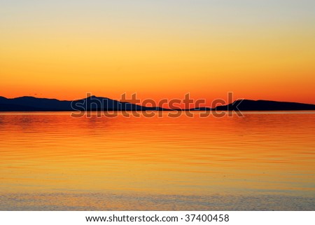 Florid seaside sunset at qualicum beach in vancouver island, british columbia, canada