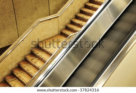 Modern moving electrical escalator and stair in edmonton subway, alberta, canada