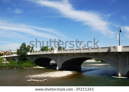 Summer view of bow river and bridge in the downtown of calgary, alberta, canada