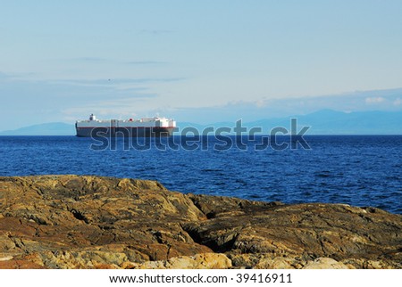 View of the strait and far mountains in sunset, victoria, british columbia, canada