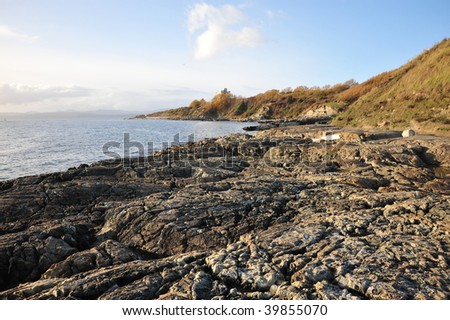 Rocks on sea shore in sunset moment, victoria, british columbia, canada