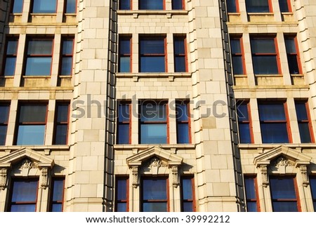 Windows of an old style office building in the downtown of victoria, british columbia, canada