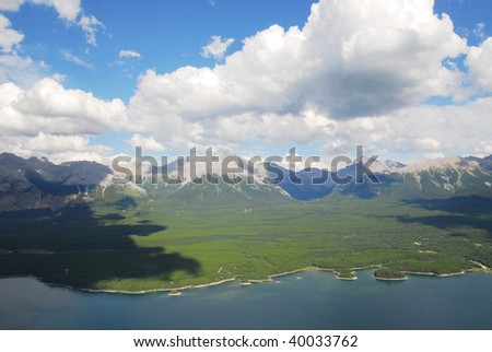 Summer view of rocky mountains and lake in lights and shadows, kananaskis country, alberta, canada