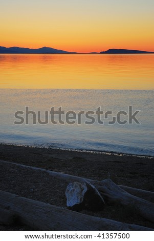Florid seaside sunset at qualicum beach in vancouver island, british columbia, canada