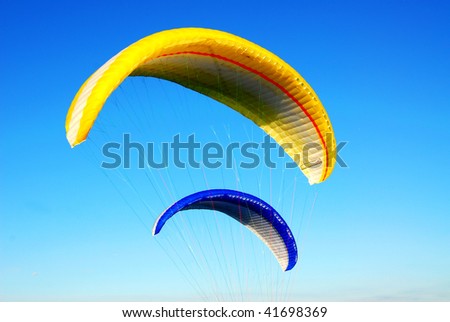Parachutes flying in the blue sky at victoria, british columbia, canada