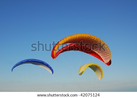 Parachute flying in the blue sky at victoria, british columbia, canada