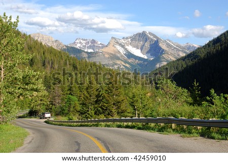 local road to mountains, waterton lakes national park, alberta, canada